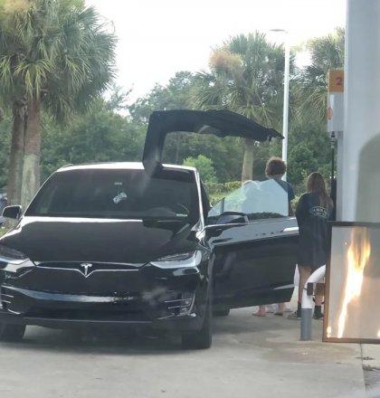 3-teens-trying-to-figure-out-where-to-put-gas-in-their-Tesla.jpg