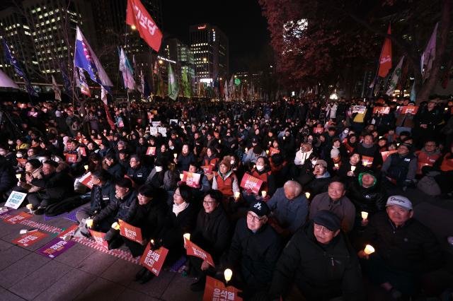 Citizens gather to demand the resignation and arrest of President Yoon Suk Yeol near Gwanghwamun Station in Seoul on Dec 4 2024 AJP Han Jun-gu